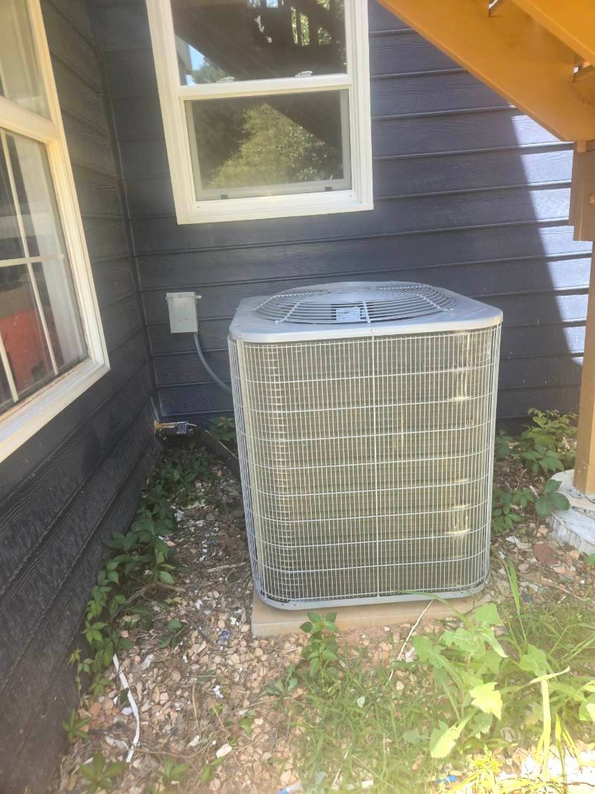 Outdoor condenser on a concrete pad