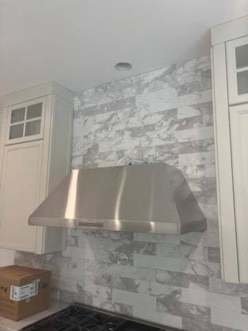Residential kitchen range hood installation