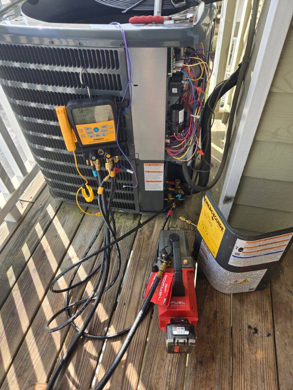 Outdoor condenser with electrical panel open for service